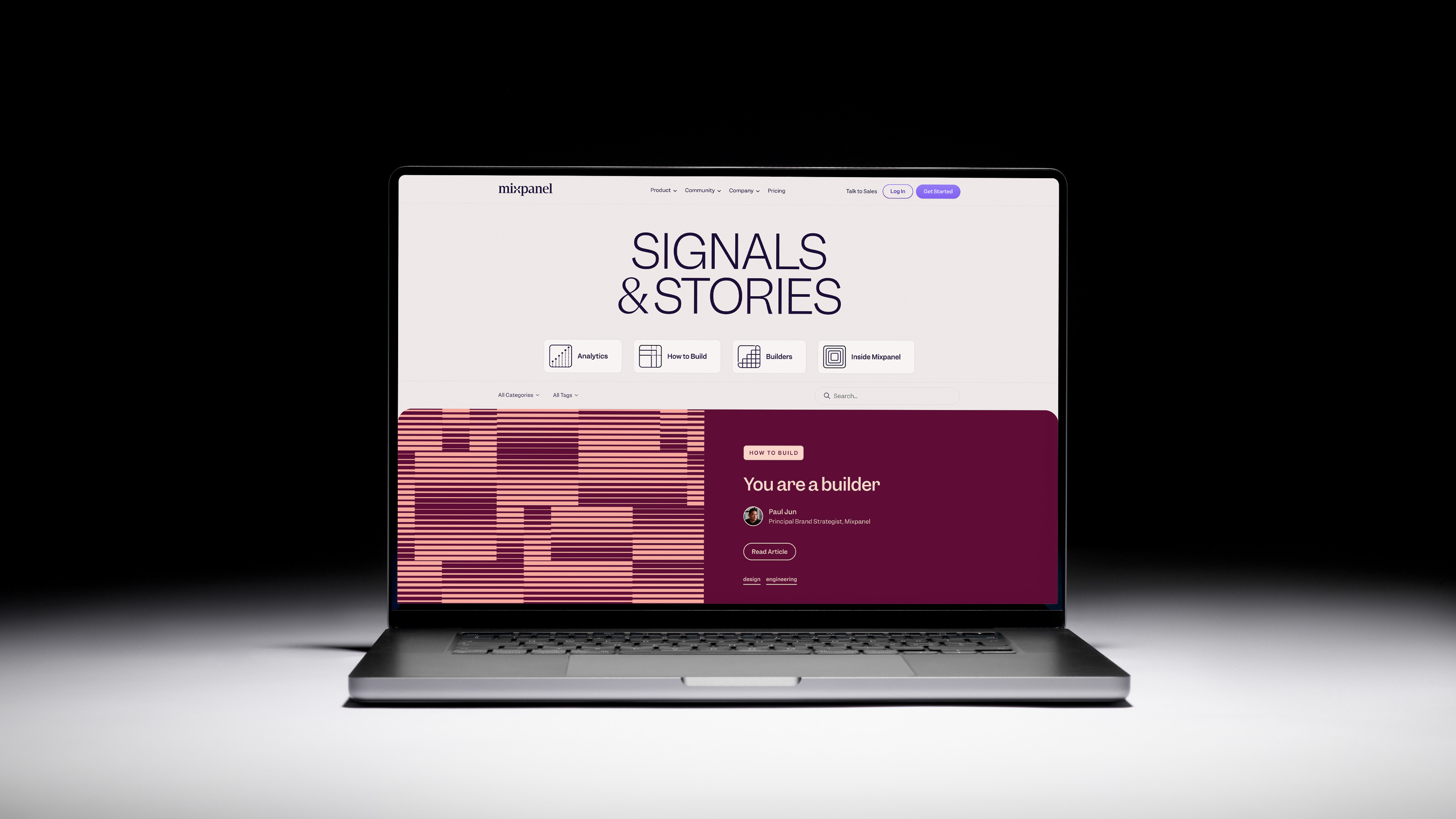 Preview of the new Signals & Stories blog homepage mocked up on a laptop